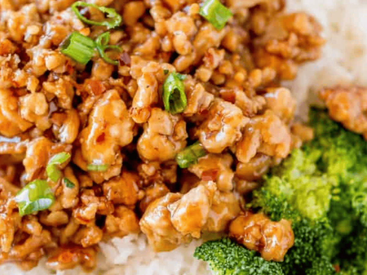 Close up of chicken with rice and broccoli