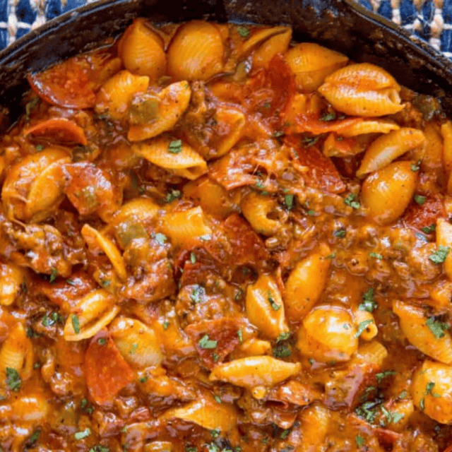 pasta cooked in meat sauce in a skillet