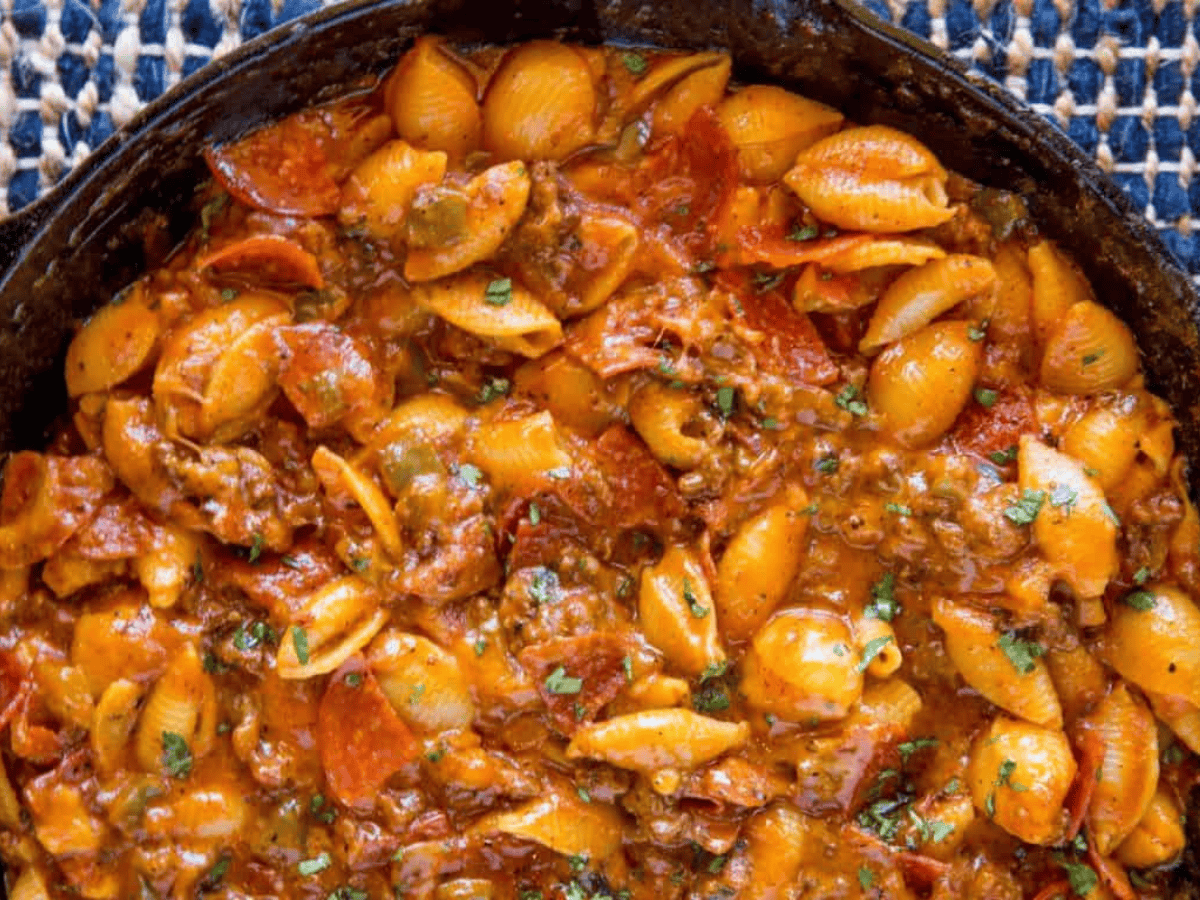 pasta cooked in meat sauce in a skillet
