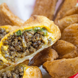 Halved egg rolls with potato wedges