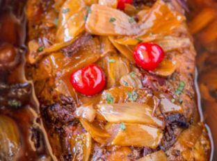 Slow Cooker Dr. Pepper Pulled Pork is sweet and spicy with brown sugar, maraschino cherries and candied jalapenos. Perfect for dinners or lunches in sandwiches and so easy to make!