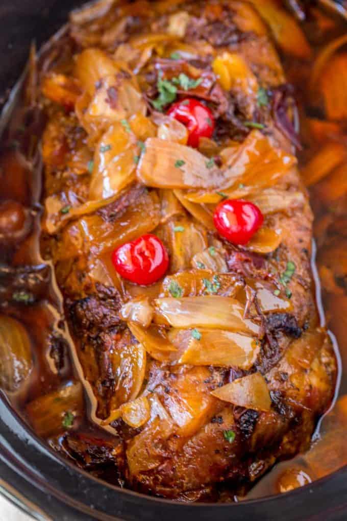 Slow Cooker Dr. Pepper Pulled Pork is sweet and spicy with brown sugar, maraschino cherries and candied jalapenos. Perfect for dinners or lunches in sandwiches and so easy to make!
