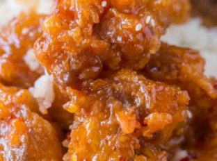 Crispy Sesame Chicken is easy to make with super crispy batter and delicious sesame sauce you'll skip the takeout!