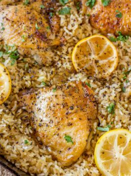 One Pot Greek Chicken and Rice with roasted lemon halves is a quick weeknight meal with garlic, lemon, and super flavorful seasoned rice pilaf.