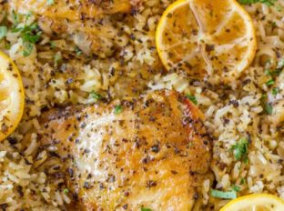 One Pot Greek Chicken and Rice with roasted lemon halves is a quick weeknight meal with garlic, lemon, and super flavorful seasoned rice pilaf.