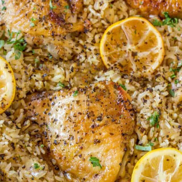 One Pot Greek Chicken and Rice with roasted lemon halves is a quick weeknight meal with garlic, lemon, and super flavorful seasoned rice pilaf.