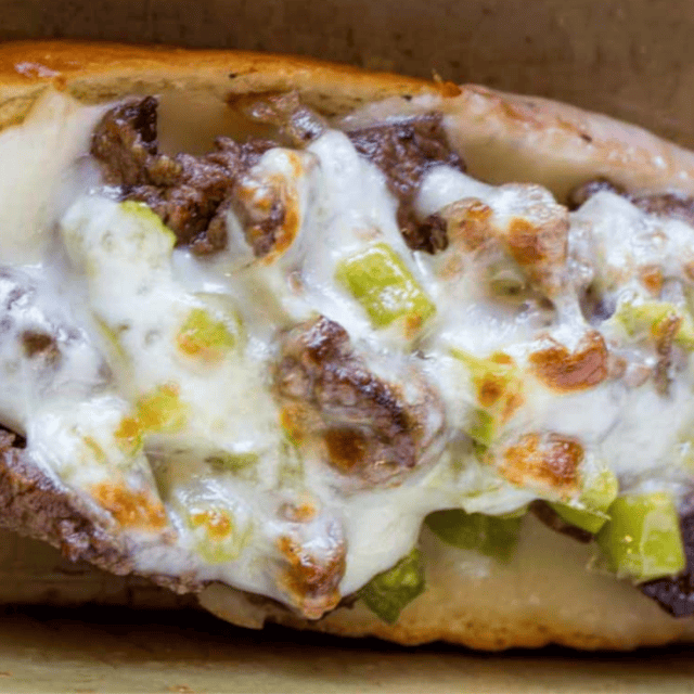 meat, veggies and cheese in a hogie