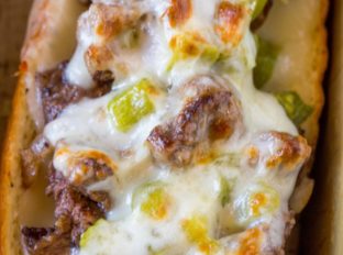 Oven Baked Philly Cheesesteak Sandwiches made for a crowd in just 30 minutes. Hot and freshly baked sandwiches for a crowd with none of the hard work!