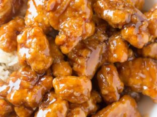 Panda Express Orange Chicken with tender chicken thighs fried crisp and tossed in a magical perfect-copycat sauce!