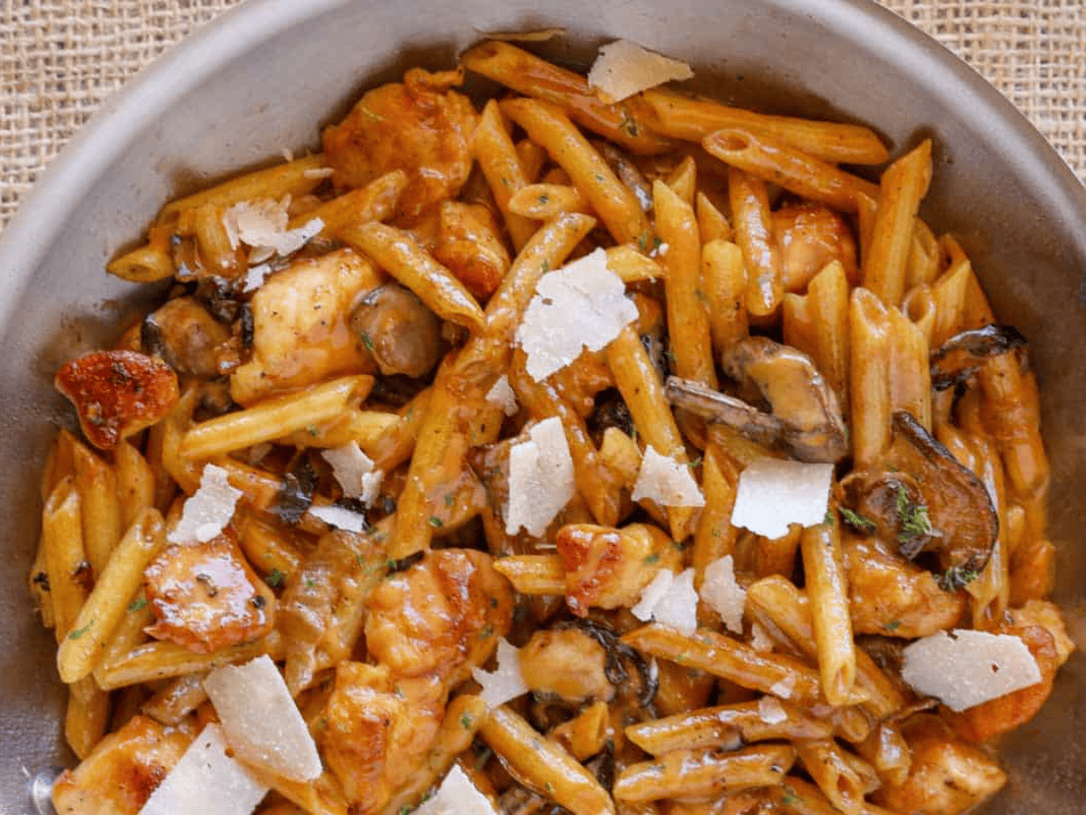 pasta topped with cheese in a pan 