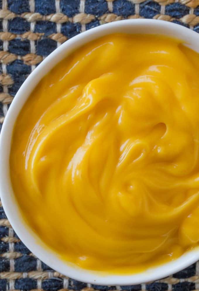 Condensed cheese soup in a white bowl