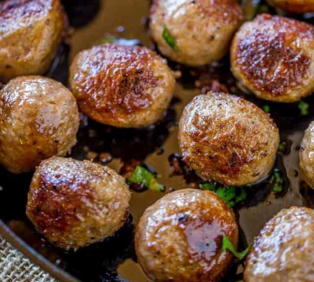 meatballs with a crispy crust in a hot skillet