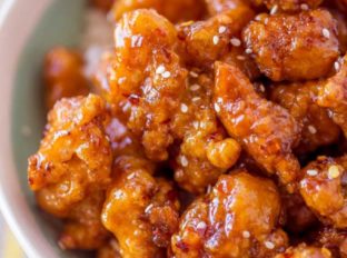 Crispy Korean Fried Chicken in a spicy, sweet glaze that is so crispy and sticky you'll coat everything in this sauce from wings to baked chicken breasts and more!