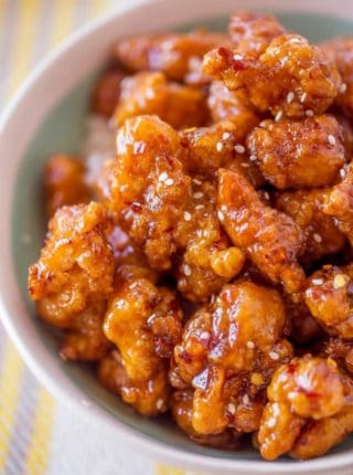 Crispy Korean Fried Chicken in a spicy, sweet glaze that is so crispy and sticky you'll coat everything in this sauce from wings to baked chicken breasts and more!