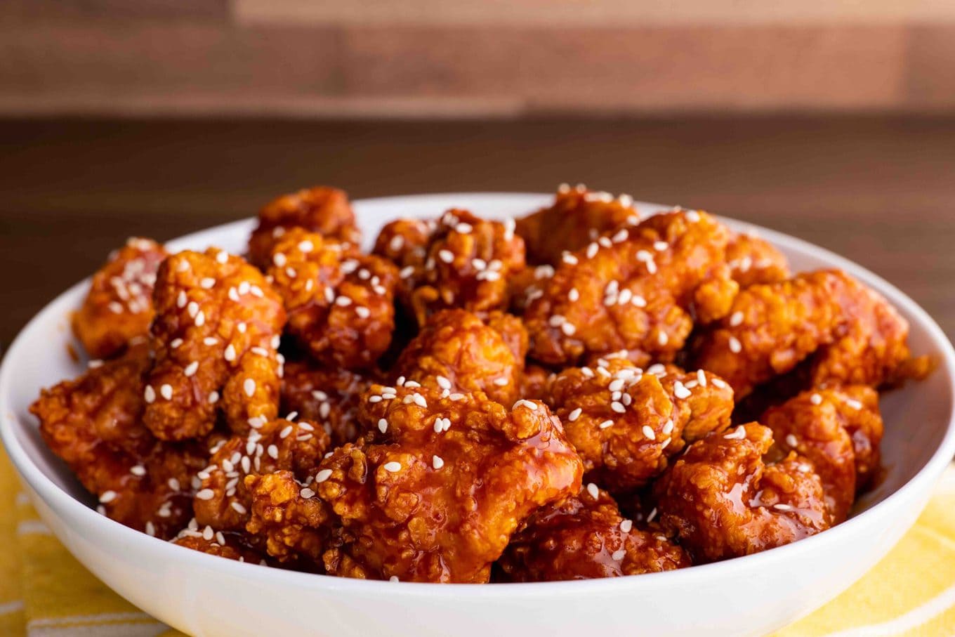 Korean Fried Chicken in bowl with sesame seeds