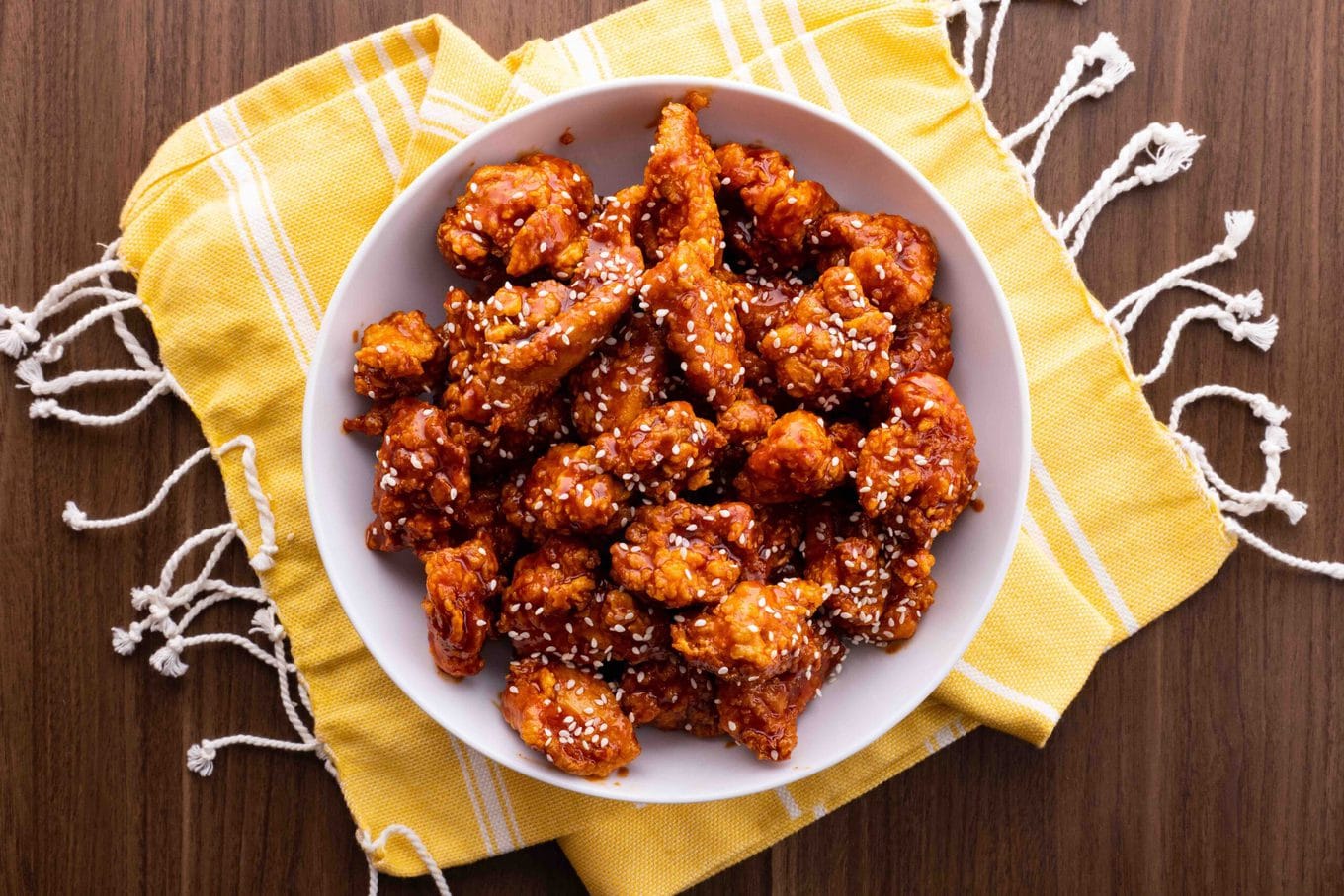 Korean Fried Chicken in bowl with sesame seeds