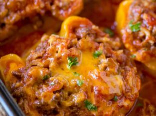 Mexican Stuffed Peppers made with ground beef, rice, black beans, salsa and cheese. Perfect for meal prepping and easy weeknight dinners!