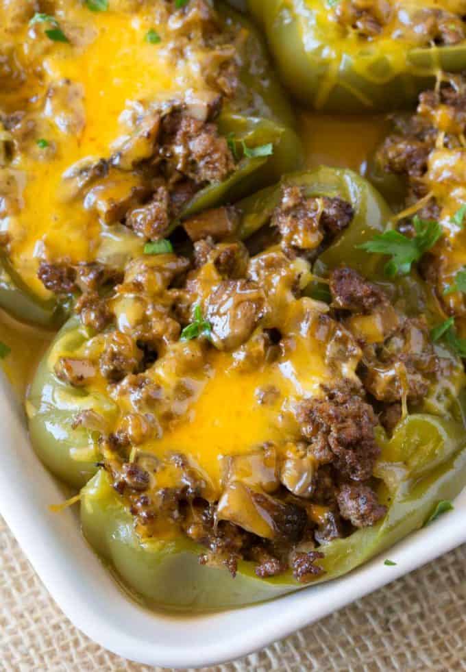 Philly Stuffed Peppers in a pan with cheese on top.