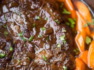 Crockpot Balsamic Pot Roast with a rich balsamic gravy and carrots and potatoes.