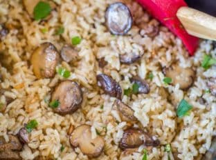 Slow Cooker Mushroom Rice made with mushrooms, caramelized onions and thyme is a deliciously buttery easy addition to your holiday meals! Stovetop directions too.