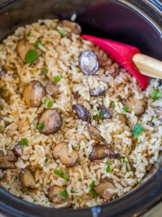 Slow Cooker Mushroom Rice made with mushrooms, caramelized onions and thyme is a deliciously buttery easy addition to your holiday meals! Stovetop directions too.