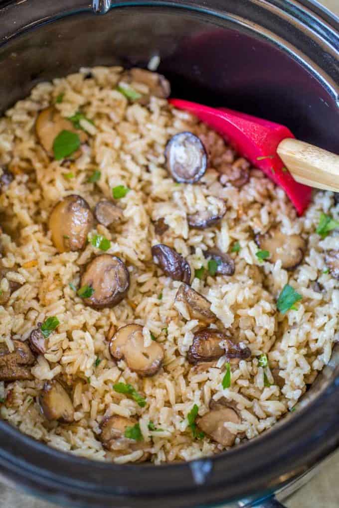 Slow Cooker Mushroom Rice made with mushrooms, caramelized onions and thyme is a deliciously buttery easy addition to your holiday meals! Stovetop directions too.