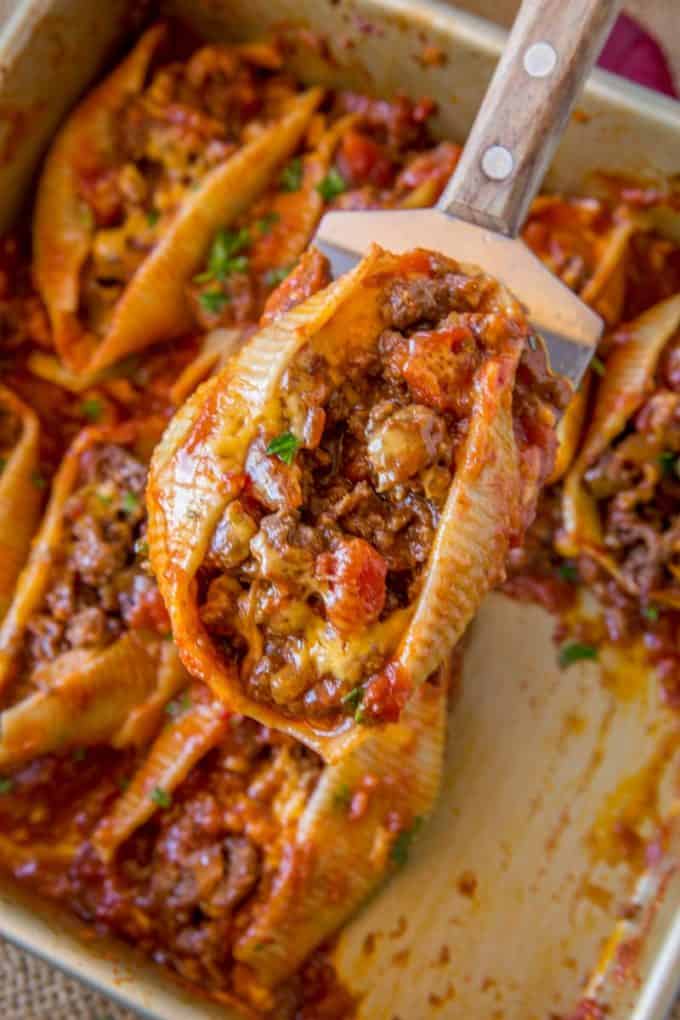 Cheesy Taco Stuffed Shells made with jumbo pasta shells, salsa, cheese and taco meat are the perfect EASY weeknight meal that you can prepare ahead of time too!