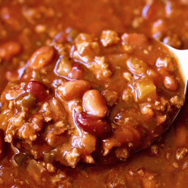 Close up of cooked chili on serving spoom