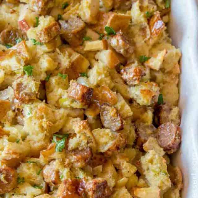 Easy Apple and Sausage Stuffing made with sage and celery is the classic dressing recipe you grew up eating. #thanksgiving #christmas #holiday #recipe #stuffing #sausagestuffing dinnerthendessert.com