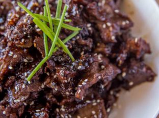 Crispy Orange Beef made with crispy, tender slices of steak coated in an orange garlic-ginger sauce in just 30 minutes!