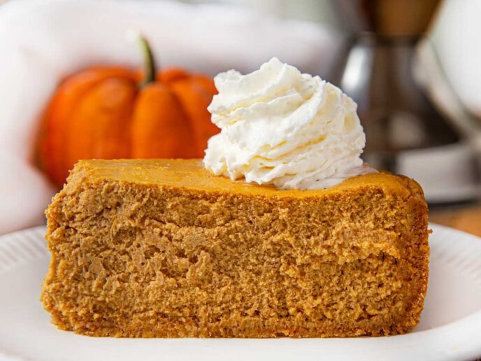 Pumpkin Cheesecake on plate with whipped cream
