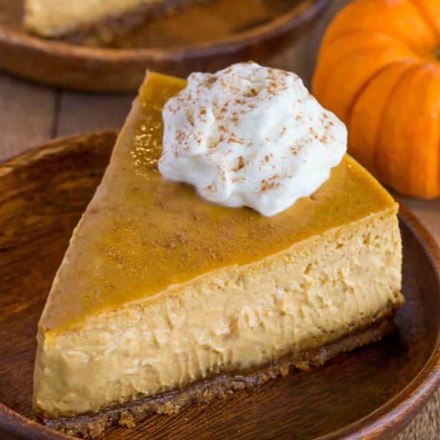 Pumpkin Cheesecake with a Gingersnap crust is a classic holiday dessert that is creamy and rich with fresh pumpkin and homemade pumpkin spice flavors.