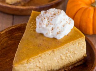 Creamy, rich and decadent Pumpkin Cheesecake with Gingersnap Crust.