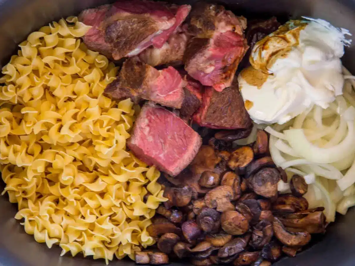 ingredients in the slow cooker before cooking 