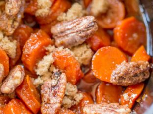 Slow Cooker Brown Sugar Carrots are an easy (and inexpensive) side dish for your holiday meals! Much lower in calories than sweet potatoes with a similar awesome flavor!