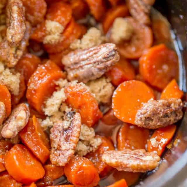 Slow Cooker Brown Sugar Carrots are an easy (and inexpensive) side dish for your holiday meals! Much lower in calories than sweet potatoes with a similar awesome flavor!