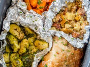 Slow Cooker Thanksgiving Dinner with turkey, sweet potatoes, sausage stuffing and Brussels Sprouts cooked entirely in your Slow Cooker!