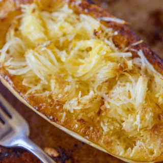 squash after it has come out of the oven with a fork beside it