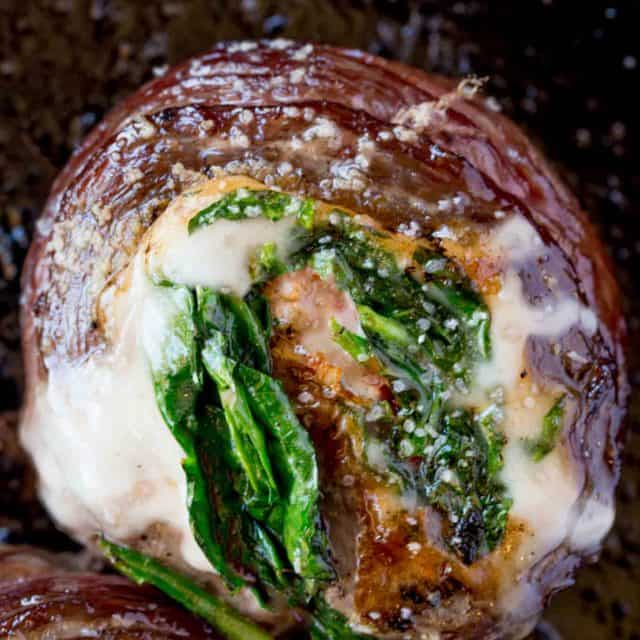 Spinach Artichoke Stuffed Flank Steak is a show stopping dish with provolone, spinach and artichokes that is dinner party ready in half an hour.