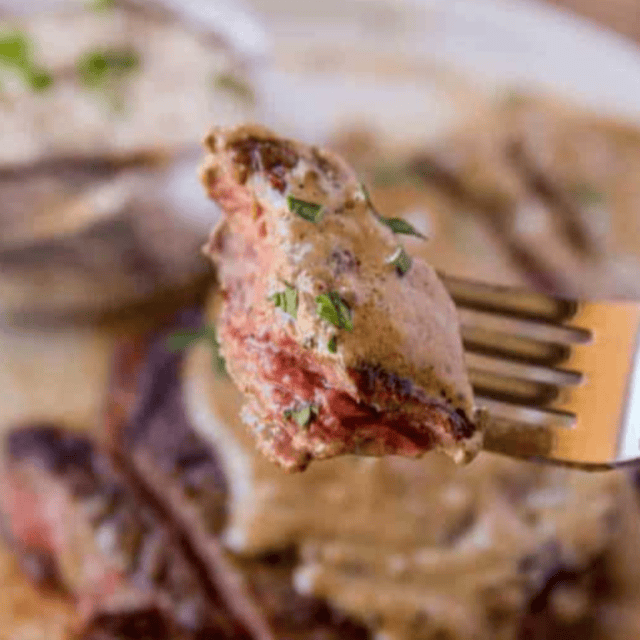 Steak on fork ready to eat