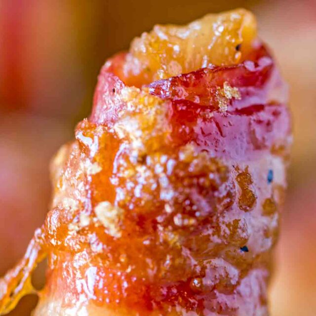 chicken bacon bite in fingers