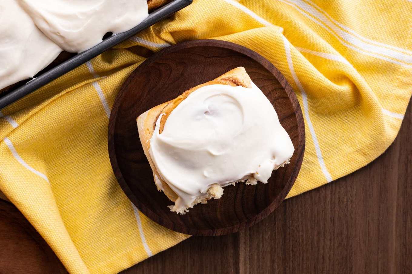 Easy Cinnamon Rolls on plate with cream cheese frosting