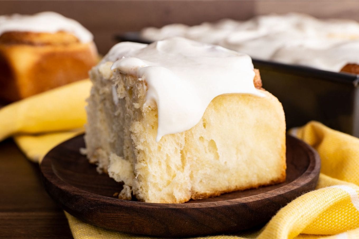 Easy Cinnamon Rolls on plate with cream cheese frosting