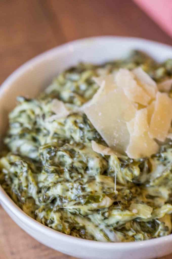 creamed spinach served in white bowl