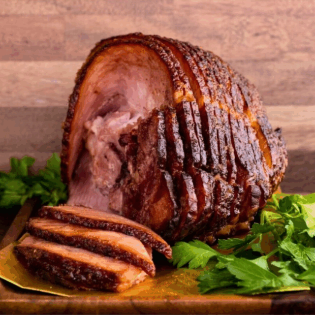 Whole ham on wooden serving platter