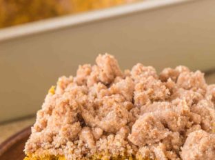 Pumpkin Crumb Cake with a New York Bakery Style giant brown sugar crumble topping is a fall bakery treat you'll enjoy for breakfasts all winter long.