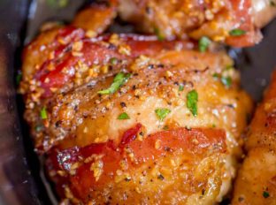 Slow Cooker Bacon Brown Sugar Garlic Chicken is made with just five ingredients in your slow cooker. Sticky, garlicky, sweet fall apart bacon and chicken goodness.