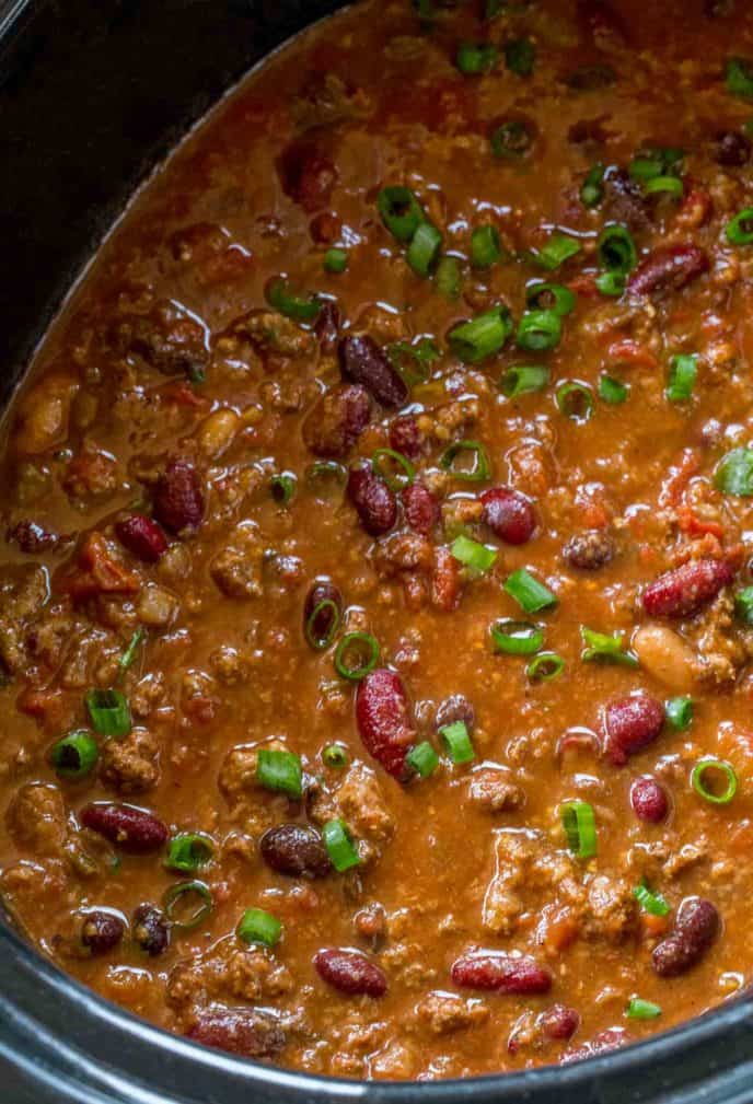 crockpot chili with scallions on top