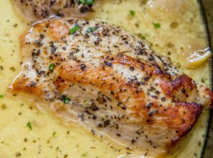 Slow Cooker Creamy Lemon Chicken with butter, garlic and lemon coating tender chicken breasts in a creamy sauce. Even great as a pasta topping!