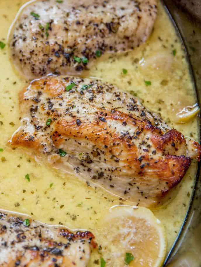 Slow Cooker Creamy Lemon Chicken with butter, garlic and lemon coating tender chicken breasts in a creamy sauce. Even great as a pasta topping! 